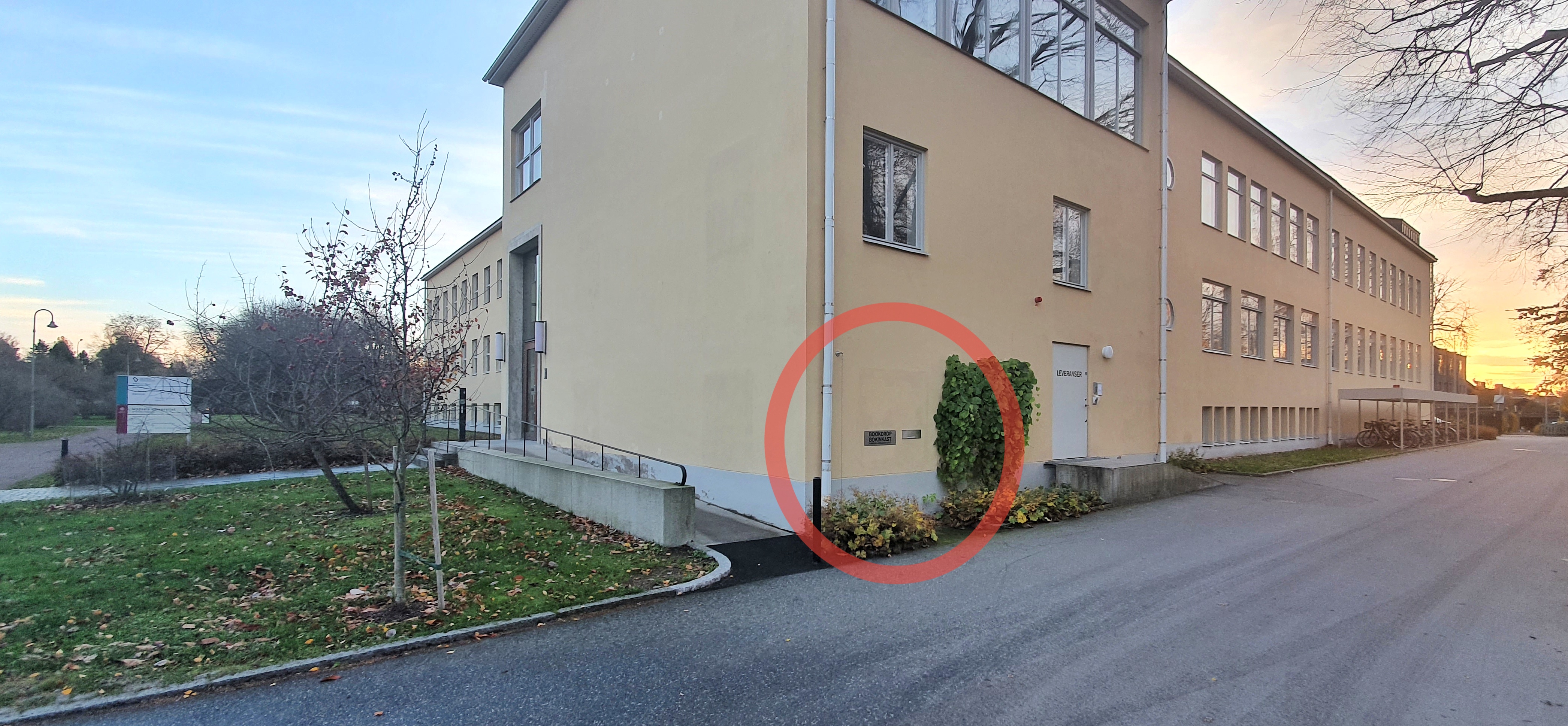 Red circle showing placement of the library's bookdrop around the corner from the main entrance.