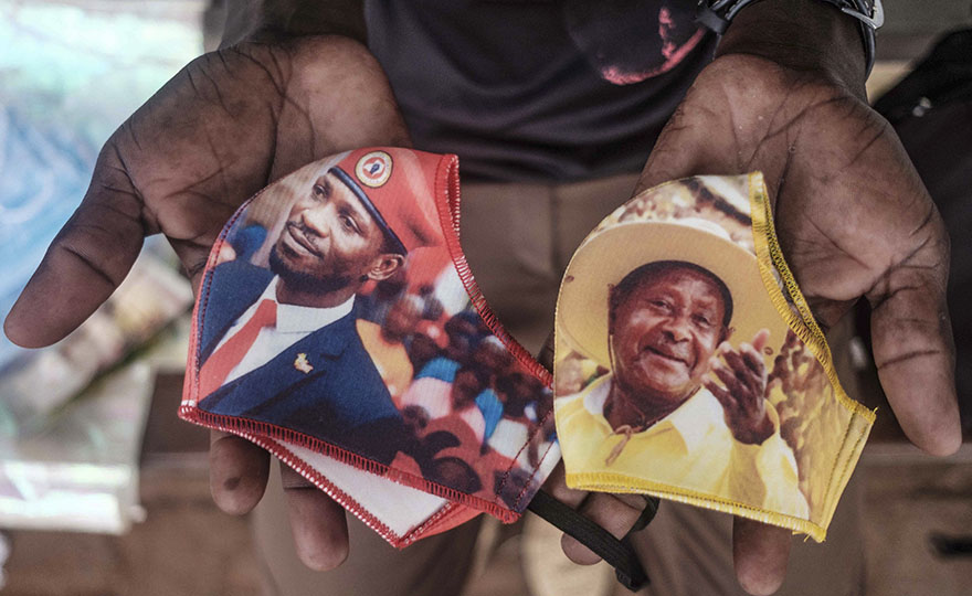 Face masks with presidential election candidates, Robert Kyagulanyi, aka Bobi Wine, and incumbent President Yoweri Museveni sold on the street in Kampala. Uganda’s Electoral Commission had declared the 2021 vote a “scientific election”, where public rallies would be restricted to stop the spread of Covid-19.  