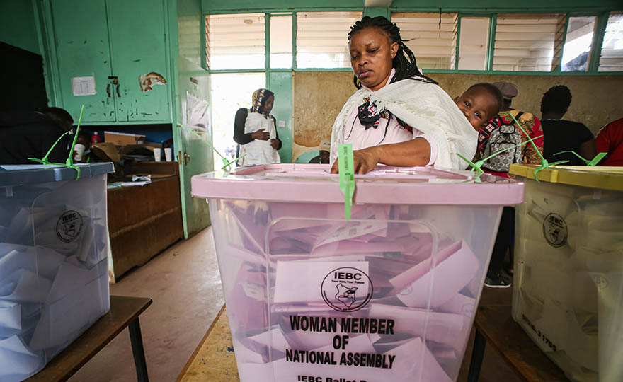 A Kenyan woman casts her vote during the general elections. On 9 August 2022, Kenyans voted to elect the president and deputy president, county Governors, members of the Senate, representatives of the National Assembly (including women county representatives) and members of County Assemblies. 