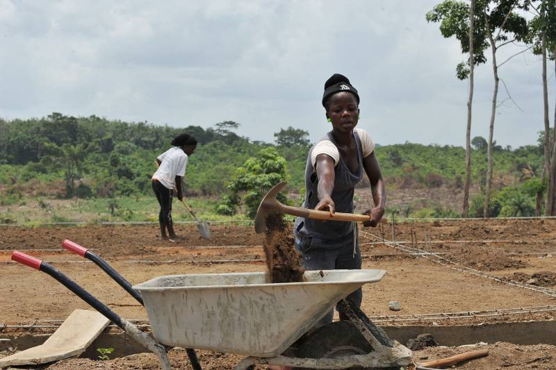 Woman shuffling soil
