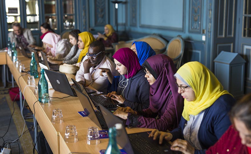Egyptian women sitting in front of computers, updating Wikipedia.