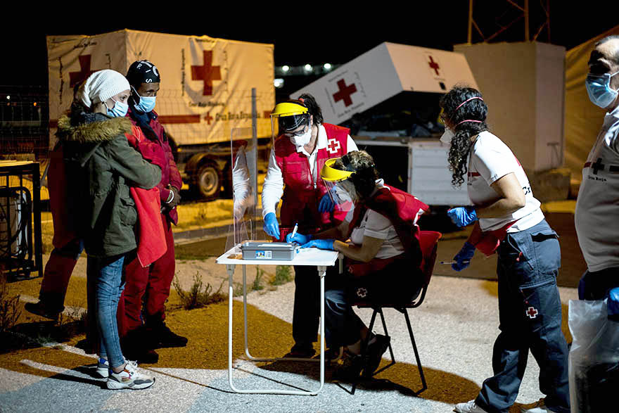 Members of the red cross register a couple of Maghreb migrants at the port of Motril, Spain.