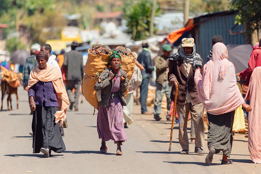 People on the street behind famous Monastery Debre Libanos, Ethiopia.