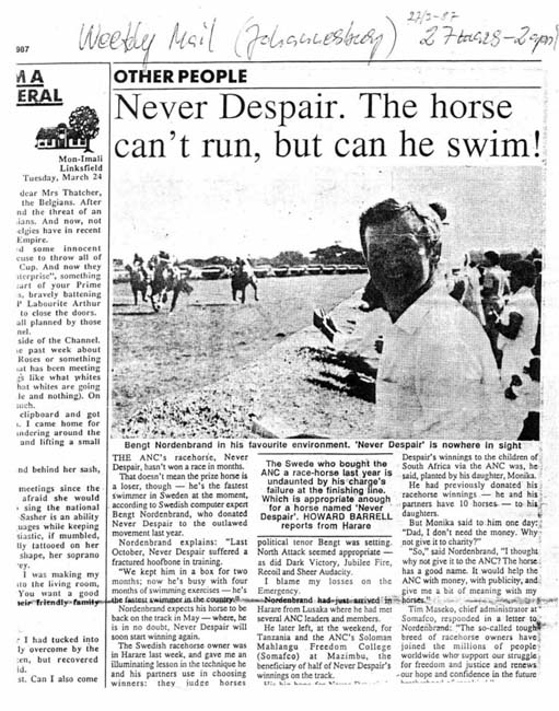 News paper article with a picture of a man and race horses.